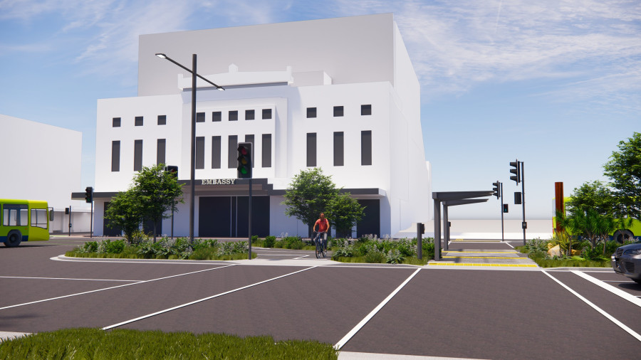 This image shows the new pedestrian crossing between Kent and Cambridge Terrace. It is taken from the Courtenay Place end, outside Napoli, looking towards the embassy. It shows the new pedestrian crossing on the right and a separate crossing for cyclists on the left. The new island includes lots of new planting and a weather shelter.